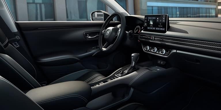 2027 Honda HR-V EX-L interior dashboard, steering wheel, and front seats (Subcompact Crossover SUV).